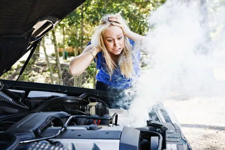 Why is my car smoking under the hood but not overheating