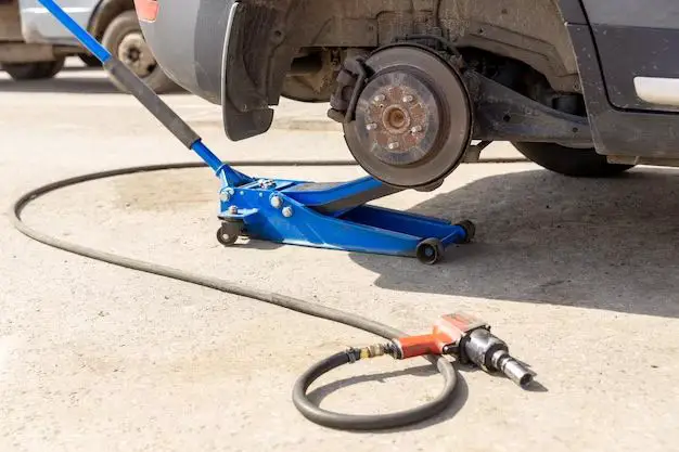 How do you jack up a lifted truck to change a tire