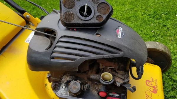 How do I clean the air filter on my lawn mower?