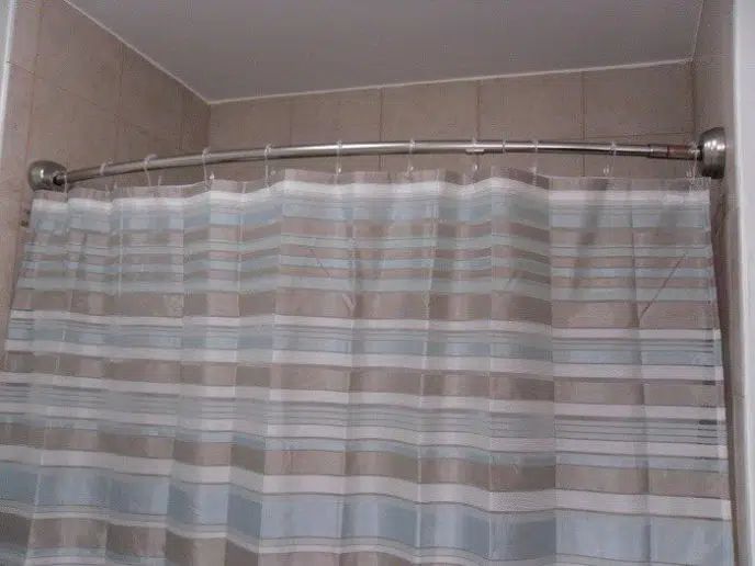 How do I stop my shower curtain from blowing inward