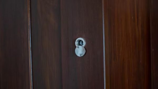 Can I add a peephole to my front door?