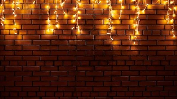 What do you use to hang Christmas lights on a brick wall?