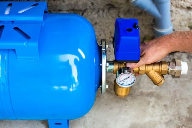 Where should a water pressure booster pump be installed