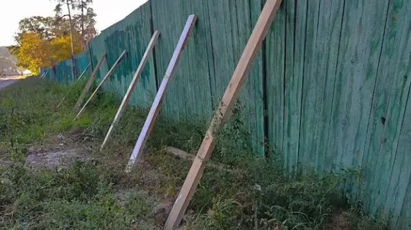 How do you fix a wooden fence post?