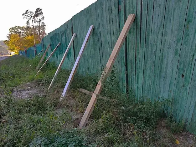 How do you fix a wooden fence post