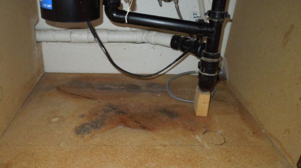 How do you replace a rotted board under a kitchen sink?