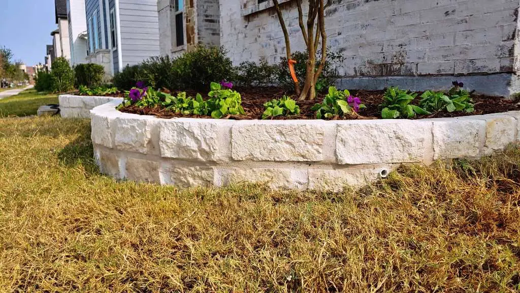 How do you make a stacked stone flower bed border