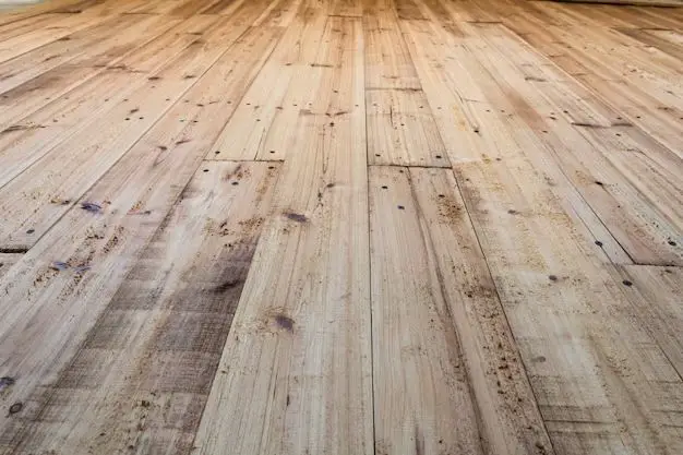 How do you prepare reclaimed wood for flooring