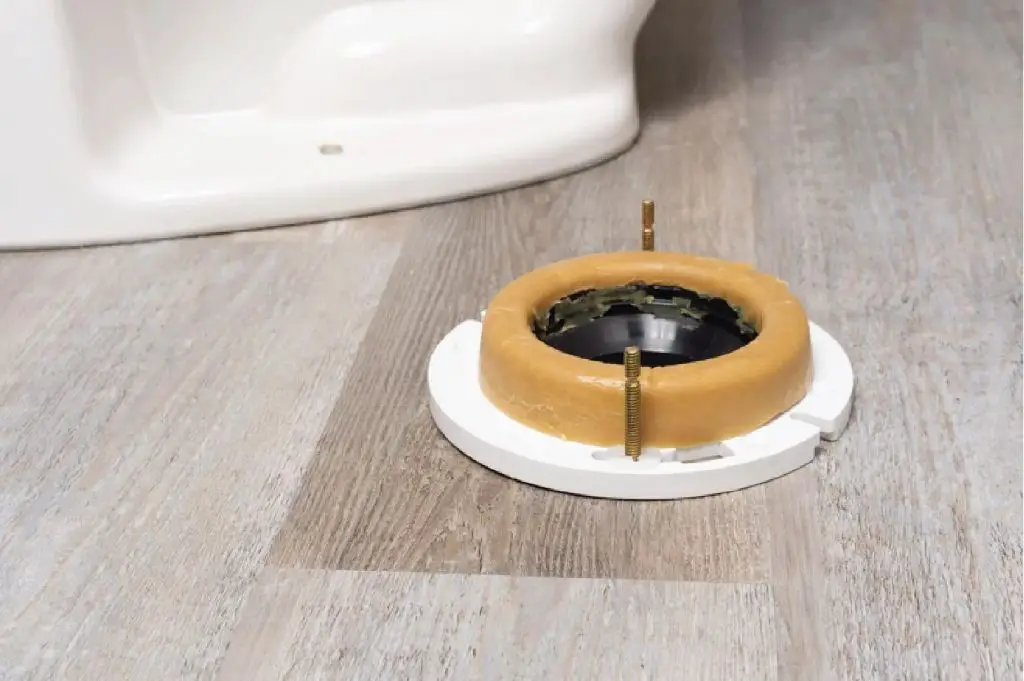 How do you fix a toilet flange under the floor