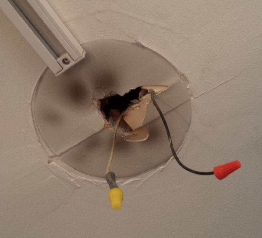 Is it safe to install a light fixture without a ground wire