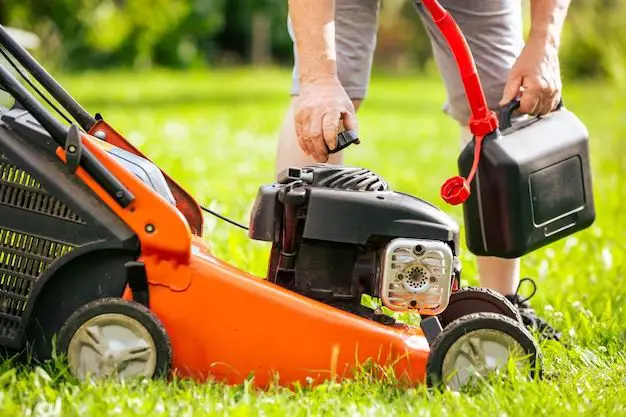 How do you fix a flooded lawn mower