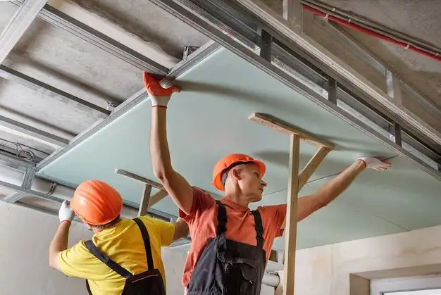 How do you hang drywall on a ceiling alone