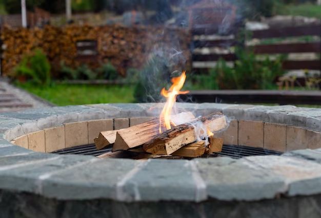 Should you remove ash from fire pit