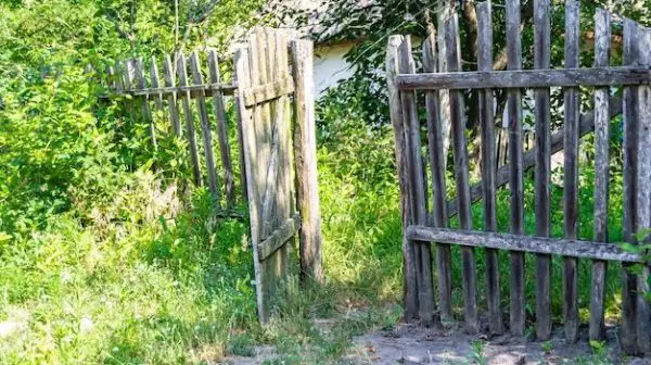 Should fence gate open inside or outside?