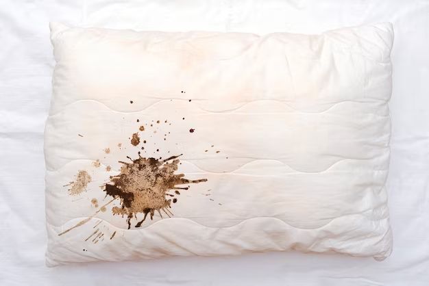 How do I get rid of blood on pillow for couch