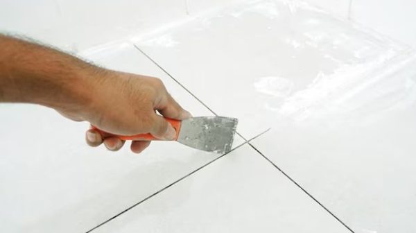 How do you remove dried paint from floor?