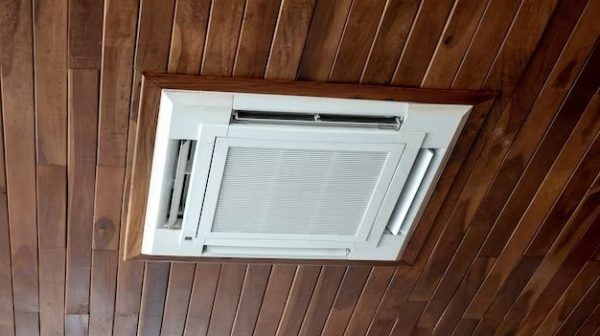 Can you cover an AC unit with wood?