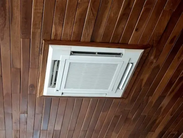 Can you cover an AC unit with wood