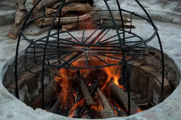 How do you build a grill over a fire pit