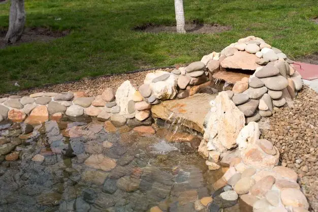How do you build a waterfall for a backyard pond