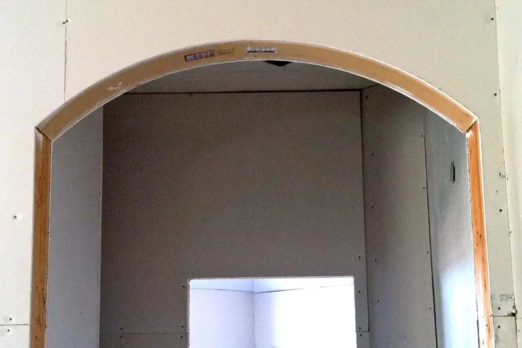 How do you drywall an arched doorway