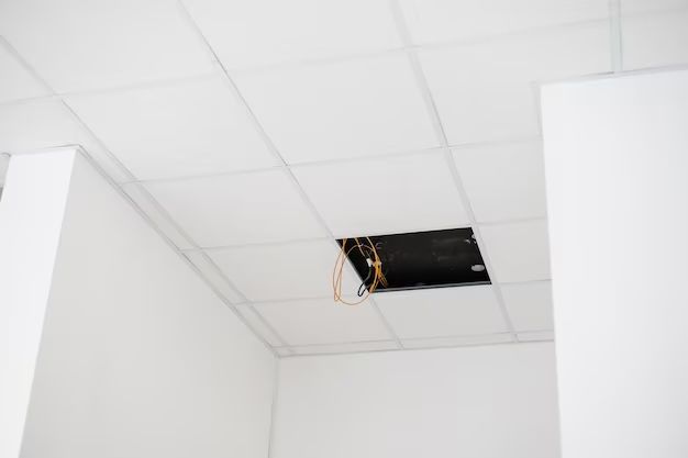 What holds up ceiling tiles