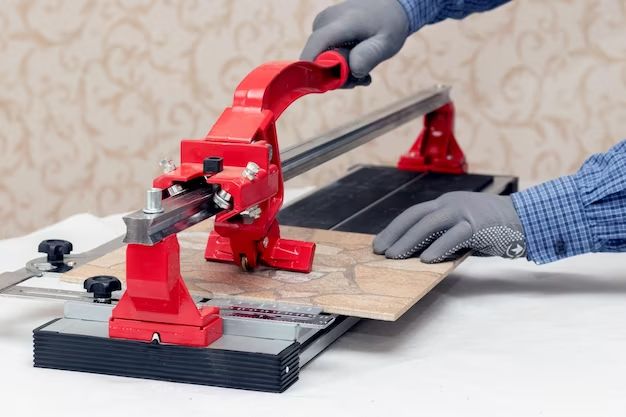 How do you use a manual tile cutter on small tiles