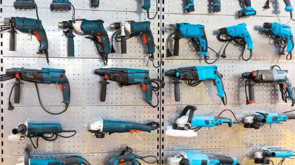 How should you store power tools when not in use?