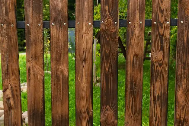 How do you attach a trellis topper to a fence