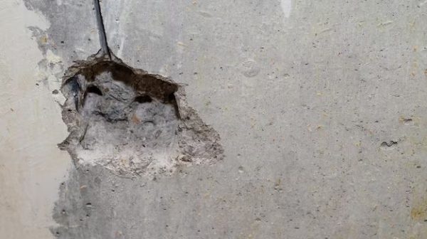 How do you fix a hole in a concrete floor?