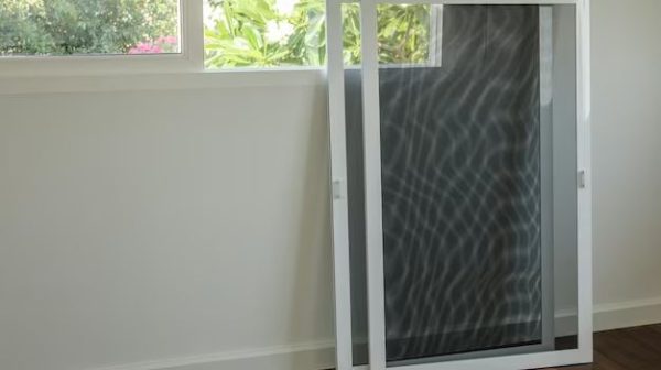 How do you remove and replace a screen door screen?