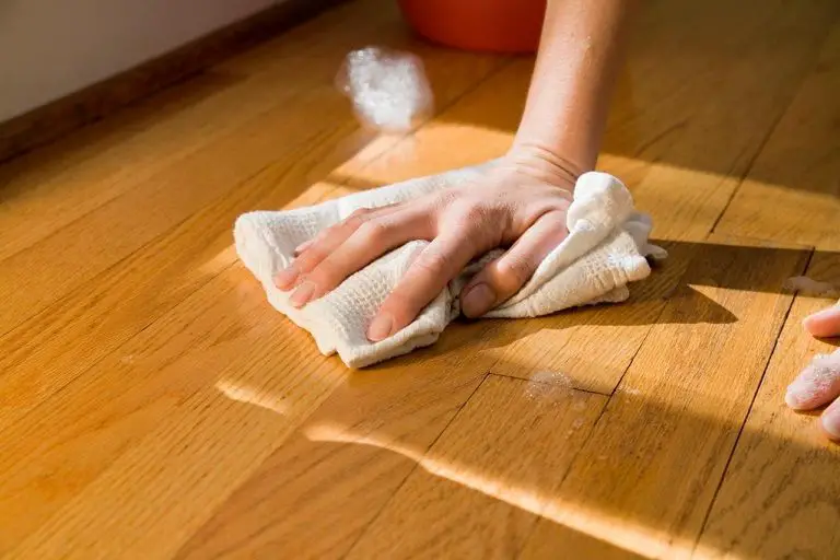 How do you get dried paint off hardwood floors without sanding