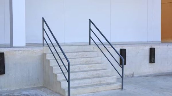 What is a railing placed on the wall of a staircase called?