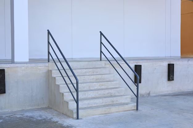 What is a railing placed on the wall of a staircase called