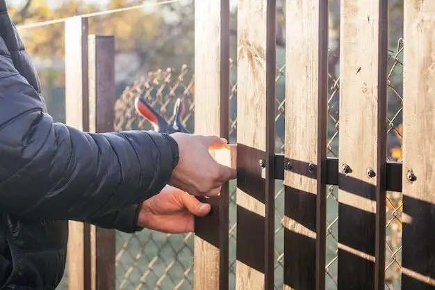 Can you attach a wood fence to chain link