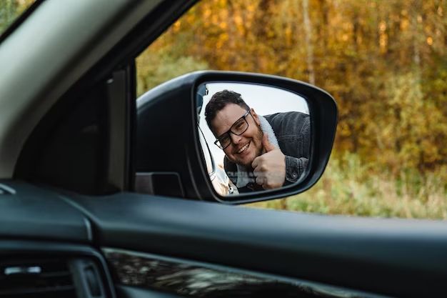 How do you stick a side mirror back on a car