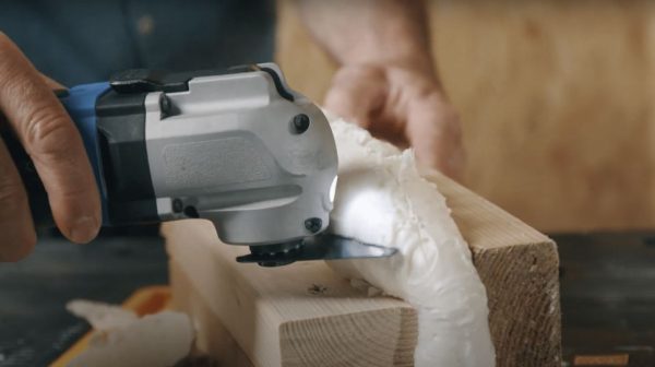 What tool is best for trimming expanding foam?