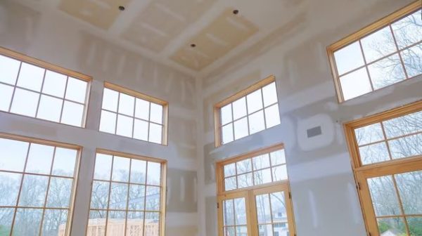 How do you finish drywall around a window?