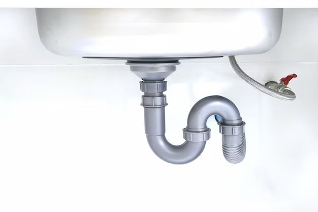 How should a double sink drain be plumbed