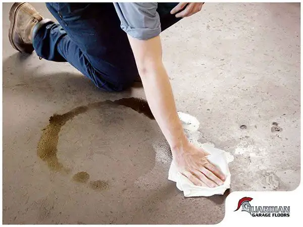 How do you remove old oil stains from garage floor