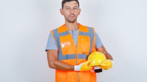 How should a construction worker dress?