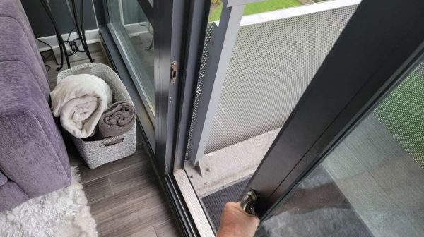 How can I make my sliding glass door slide easier?