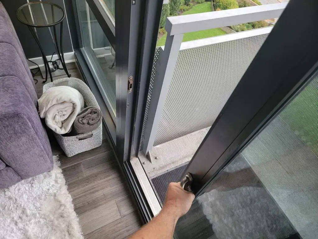 How can I make my sliding glass door slide easier