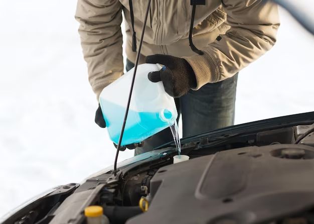 What is the windshield wiper fluid sign