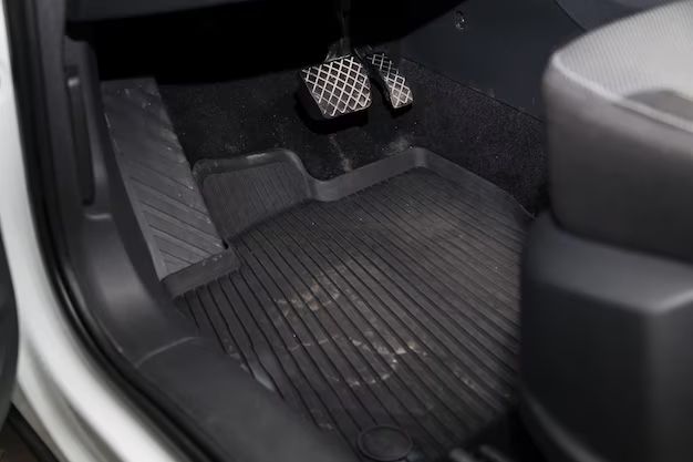 How do you clean dirty fabric car mats