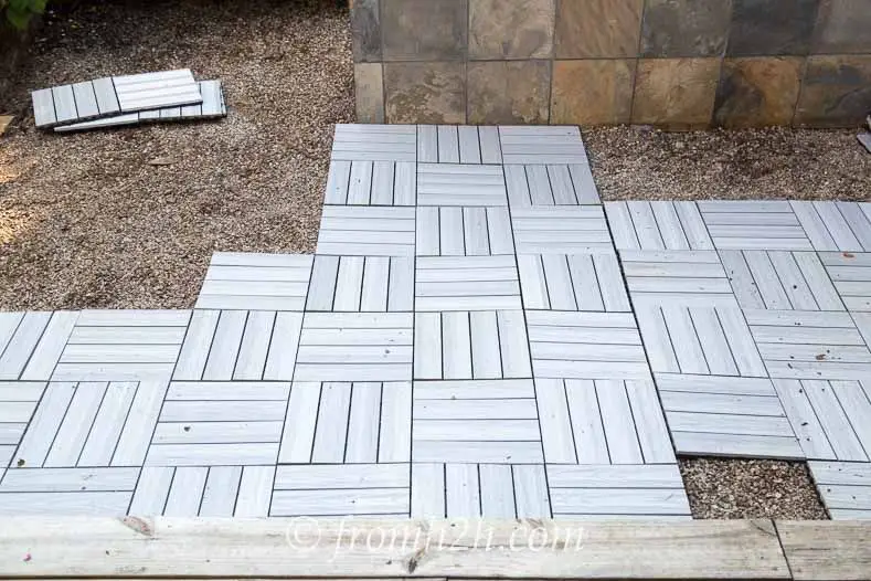 How do you lay deck tiles on soil