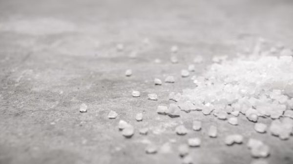 Is it OK to use rock salt on concrete?