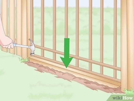 How do I stop my dog from digging under the gate