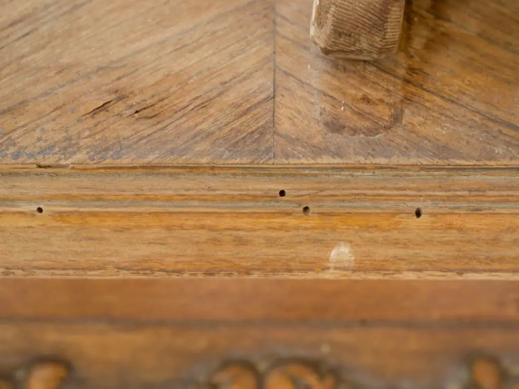 Can a hole on hardwood floor be repaired