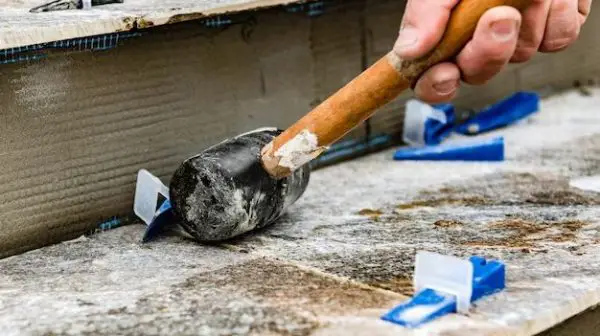 What tool removes tile from concrete?